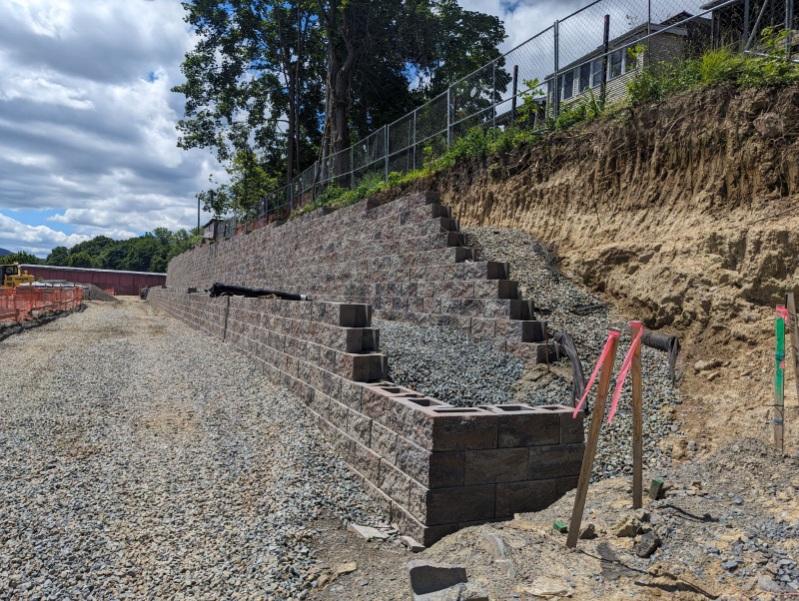 a two-tiered retaining wall with geogrid reinforcement for a commercial project